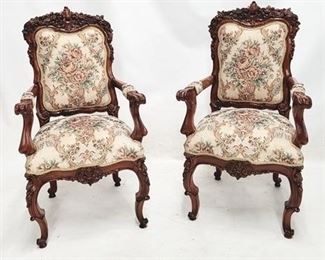 49 - Matching pair heavily carved arm chairs 2 arms