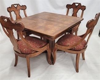 593 - Vintage carved 5 piece gaming table set parquet inlaid top table with one leaf size 29 1/2 x 42 x 42, leaf is 18" wide nicely carved hip chairs with elephant upholstery size 39 x 21 x 19