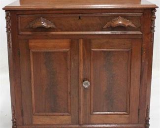 812 - Victorian carved 2 door washstand w/backsplash 33 1/2 x 29 1/2 x 16 carved handles glass knob