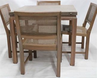 849 - Vintage mid-century table w/ 4 caned chairs table 30 x 36 x 36, doubles size when flipped open chairs 32 x 20 x 18 some minor breaks in cane