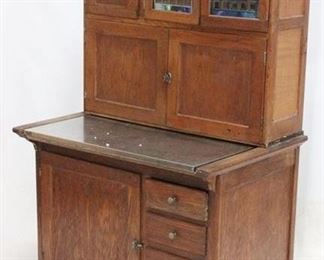 3008 - Vintage Hoosier kitchen cabinet stained glass doors original tag, beautiful finish steel surface flour bin & other attachments 67 x 40 x 28