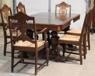 4090 - Vintage Jacobean walnut carved 7 piece dining set Table with pop up nesting leaf 30 1/2 x 60 x 39 1/2 One arm chair, 5 side chairs