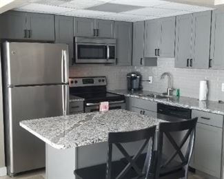 Gray "L" shape kitchen; sink run is 8 feet long; range & fridge run is 9 ft. long. APPLIANCES NOT FOR SALE!