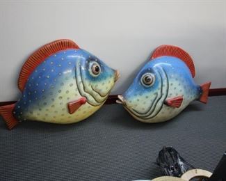 Two wall hung painted fish by Carlos Alberto