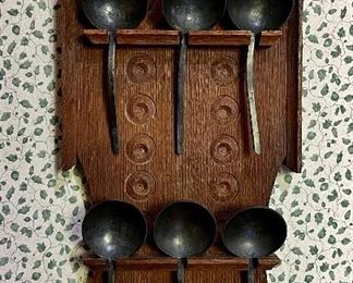 Cast Iron Spoons on Wall Rack