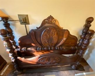 Full view of the walnut stained vintage 20’s-30’s head and footboard