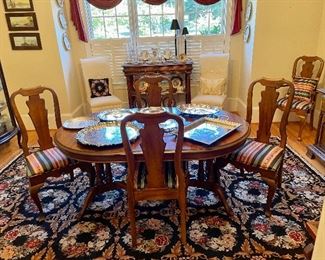 Stanley Furniture Company 2 pedestal Dining table with six dining chairs (two with arms), Two leafs to table, handmade needlepoint rug, Silver plated trays...
