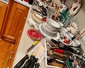 Knives, ice picks,  can openers,  graters,  apple dishes, goblets,  pottery mugs, Hull coffee mugs, glasses, Pyrex casserole, wooden spoons, Franciscan Ware Apple large serving pieces...