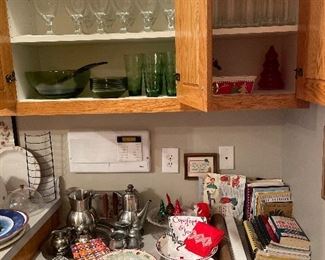 Top cabinet green glass salad bowl plates and glasses, goblets, pewter pieces pewter pieces, cookbooks, Christmas dishes, Vintage The Betty Turness Westinghouse thermometer set...