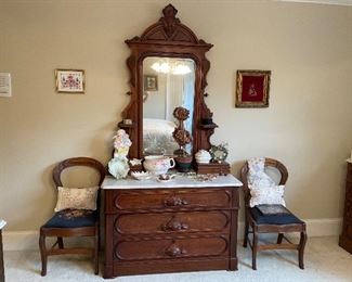 Victorian walnut dresser with marble top, handkerchief drawers and craved mirror. Two balloon back chairs with needlepoint seats. 