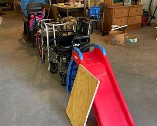 Walkers, wheelchairs, plastic children's slide, plastic kid's chairs, plastic chair and rocker, kid's blue plastic pool.