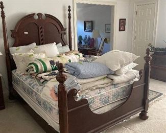 Beautiful solid wood queen bed, blue and white quilted spread with matching skirt and shams. Appliqued quilts, blue quilted bedspread, sheets, pillows, blankets and more