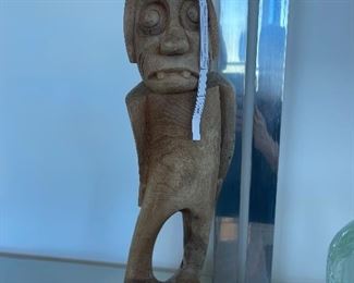 New Guinea (I believe) Wood carving - reminiscent of a zombie Buck toothed dog. 