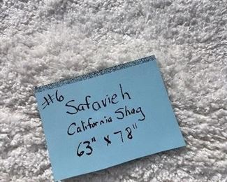 6)  $200 - Safavieh California Shag  100% Polypropylene. Made in Turkey.  White.  63 x 78.  Clean with no apparent spots or stains.  