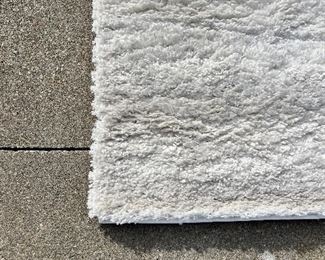 6)  $200 - Safavieh California Shag  100% Polypropylene. Made in Turkey.  White.  63 x 78.  Clean with no apparent spots or stains.  