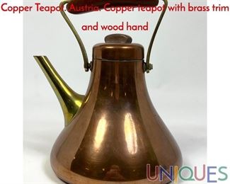 Lot 14 Wiener Werkstatte KARL HAGENAUER Copper Teapot. Austria. Copper teapot with brass trim and wood hand