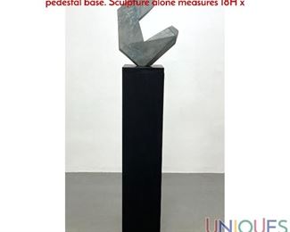 Lot 55 Modernist Carved Stone Sculpture. Faceted form. Black pedestal base. Sculpture alone measures 18H x
