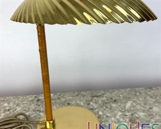 Lot 94 GUBI Paavo Tynell brass shell Table Lamp. Labeled.