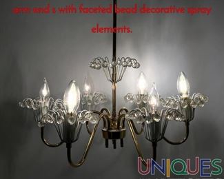 Lot 121 Modernist Brass 6 Arm Chandelier. Each arm end s with faceted bead decorative spray elements.