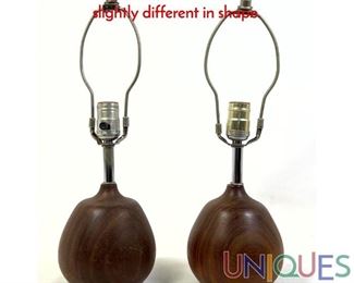 Lot 138 Pair teak sculptural lamps teardrop shape. slightly different in shape.