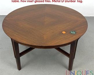Lot 145 DUNBAR Round American Modern Walnut Coffee Table. Few inset glazed tiles. Metal D Dunbar Tag.