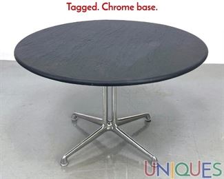 Lot 161 Eames La Fonda round slate top table. Tagged. Chrome base.