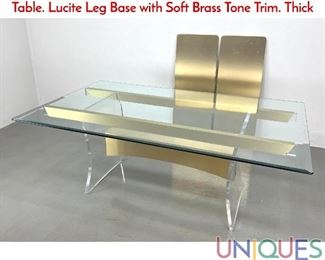 Lot 219 Vladimir Kagan style Glass And Lucite Dining Table. Lucite Leg Base with Soft Brass Tone Trim. Thick