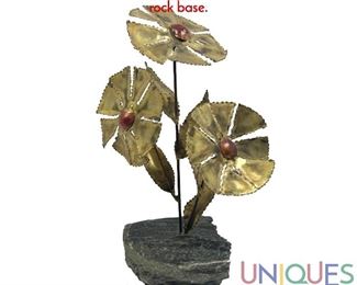 Lot 233 Brutalist Mixed Metal Flower Sculpture. Natural rock base.