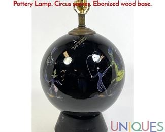 Lot 243 French Deco Globe Table Lamp. Black Globe form Pottery Lamp. Circus scenes. Ebonized wood base.