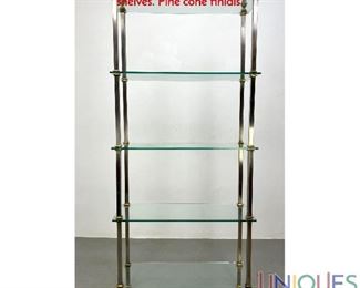 Lot 257 Regency style Stainless and Brass Etagere. Thick glass shelves. Pine cone finials.