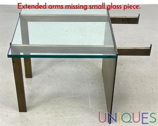 Lot 313 Modernist Glass And Metal Coffee Table. Extended arms missing small glass piece.