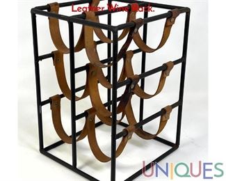 Lot 340 ARTHUR UMANOFF Black Iron and Leather Wine Rack.
