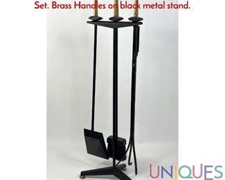 Lot 350 Donald Deskey Modernist Brass Fireplace Tools Set. Brass Handles on black metal stand.