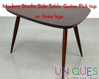 Lot 366 Philip Powell Attribution American Modern Studio Side Table. Guitar Pick top on three legs.