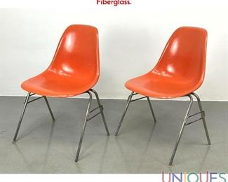 Lot 404 Pr Orange Eames shell chairs Herman Miller labels. Fiberglass.