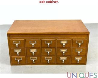Lot 489 Vintage Oak File Drawer Cabinet. 15 drawers in oak cabinet.