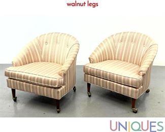 Lot 496 Pair Barrel Back Lounge Chairs on castors with walnut legs