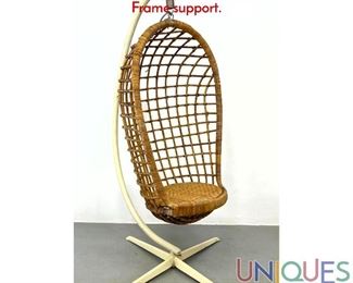 Lot 517 Vintage Hanging Rattan Wicker Chair with Metal Frame support.