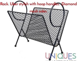 Lot 521 Modernist Black Metal Magazine Rack. Uber stylish with hoop handles. Diamond mesh sides.