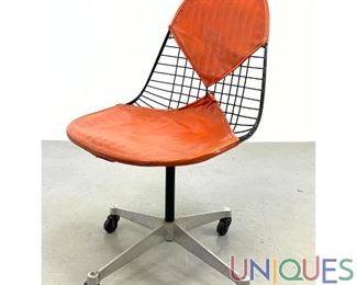 Lot 531 Early Eames wire rolling chair. Bikini cushions.