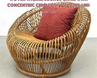 Lot 725 Franco Albini Lounge Chair. A woven wicker lounge chair with concentric circles of support and casca