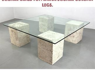 Lot 961 Coquina Stone Style Coffee Table. Square Glass Top. Large square column legs. 