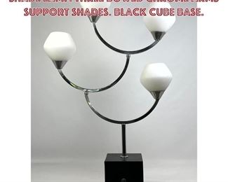 Lot 991 Unusual Modernist Chrome Four Shade Lamp. Three bowed chrome arms support Shades. Black cube base.