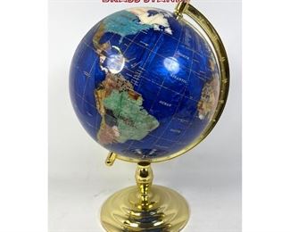 Lot 1085 Stone inlay table top globe. Brass stand. 