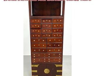 Lot 1099 Tall Multi Drawer Asian Cabinet. Small drawers are labeled. Brass Trim.