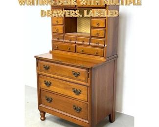 Lot 1265 Davis furniture cherry writing desk with multiple drawers. Labeled 