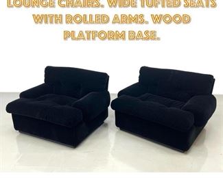 Lot 1372 Pr PACE Black Modernist Lounge Chairs. Wide Tufted Seats with Rolled Arms. Wood platform base. 