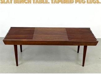 Lot 1599 Expandable Modernist Slat Bench Table. Tapered peg legs. 