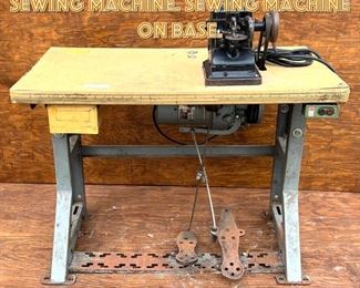Lot 1667 BONIS Never Stop Fur Sewing Machine. Sewing machine on base. 