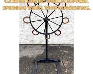 Lot 1685 Chris Hiltey Outdoor Garden Kinetic Wind Sculpture. Spinning wheel with horseshoes.